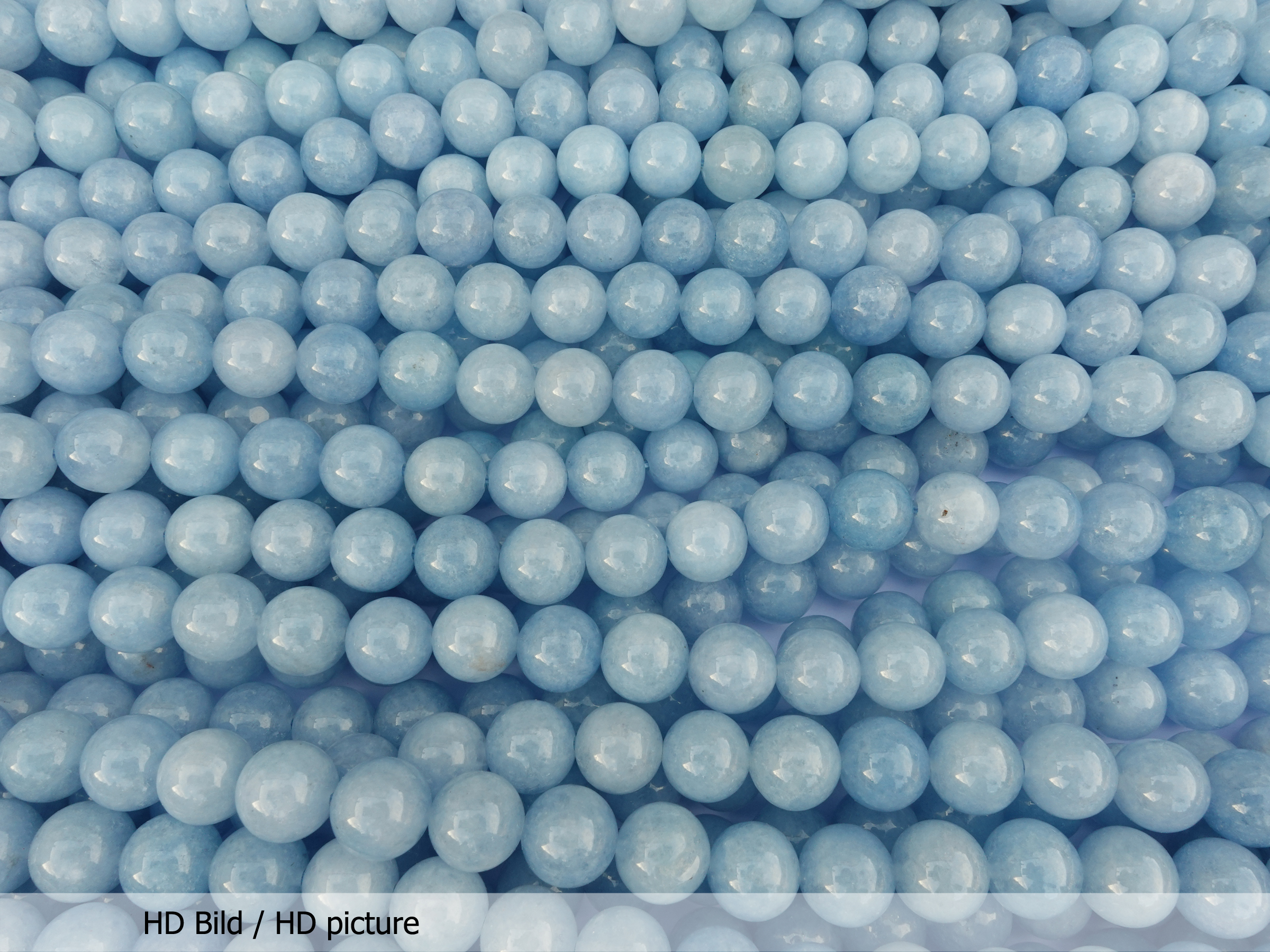 runde 10mm Steinperlen aquamarinblau eingefärbt - HD Bild