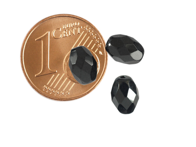 facettierte schwarze Oliven 8x6mm, Bild mit Größenvergleich