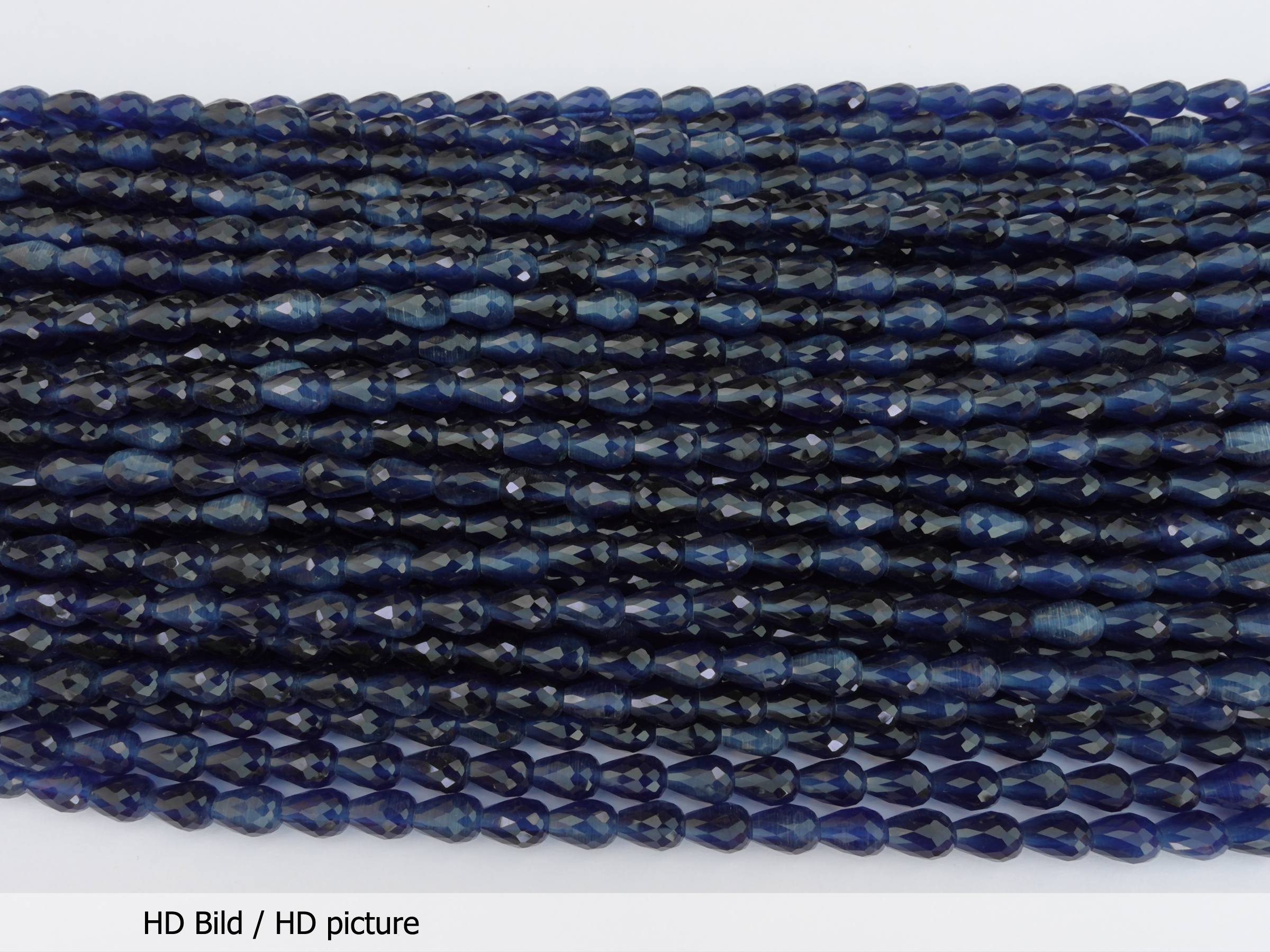 dunkelblaue geschliffene Tropfenperlen 6x8mm - HD Bild